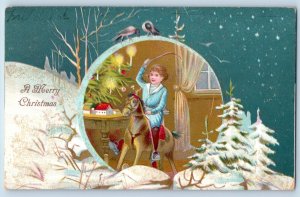Christmas Postcard Child Playing Horse Toy Pine Trees Covered Snow 1905 Antique