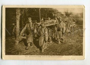 3147620 WWI medics carry wounded RED CROSS Vintage postcard