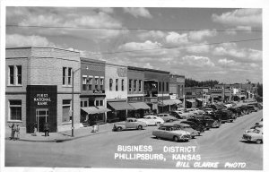 J51/ Phillipsburg Kansas RPPC Postcard c1950 Business District Stores 129