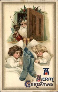 Christmas Santa Claus Sleeping Children Stockings Winsch c1910 Postcard