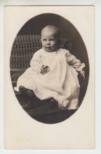 P2886 old postcard azoa RPPC baby sitting in chair.