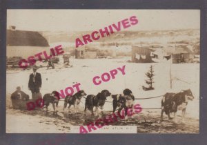 Atlin BC CANADA RPPC c1920s ROYAL MAIL TEAM Mailman DOG SLED Dogs Posing