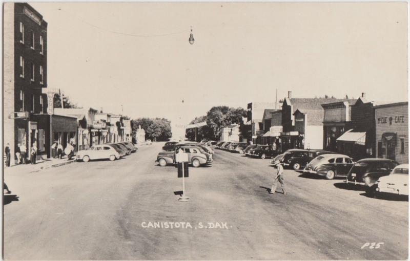 Dakota del Sur Sd Foto Real RPPC Postal C1950 canistota calle principal de tiendas de automóviles 