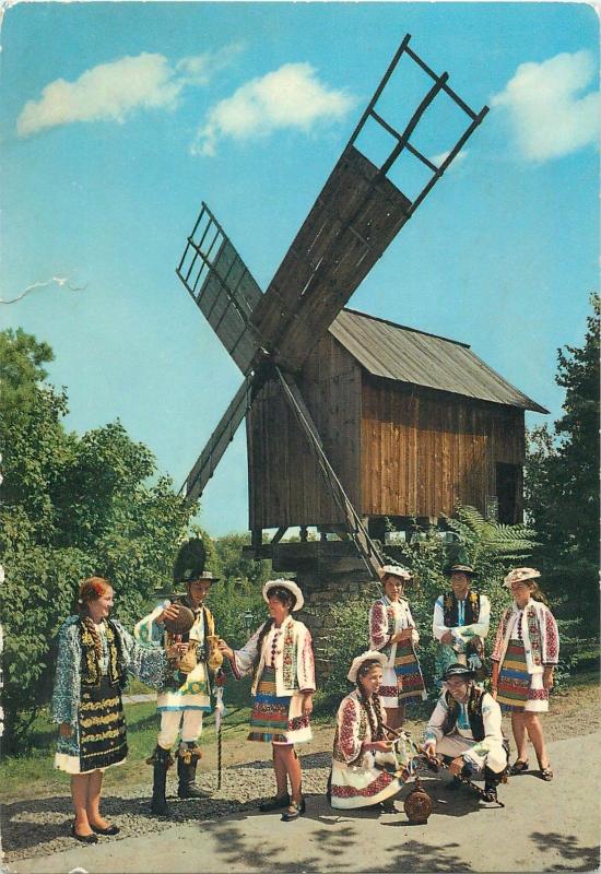 Romania folk costumes dancers from Bistrita Nasaud wind mill