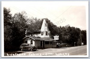 K32/ Otter Lake New York RPPC Postcard c1950s Lighthouse Cabins 1062