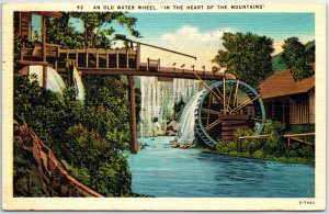 VINTAGE POSTCARD AN OLD WATER WHEEL IN THE HEART OF THE MOUNTAINS ASHEVILLE NC