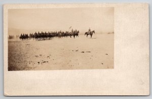 RPPC US Army Cavalry Soldiers On Horseback With Flag Man Real Photo Postcard Q27