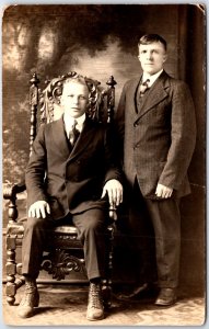 Two Young Men Suit, Vest and Tie in Decorative Chair Portrait Vintage Postcard