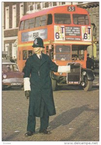 LONDON, England, 1950-1970's; London Policeman Controling Traffic, Double Dec...