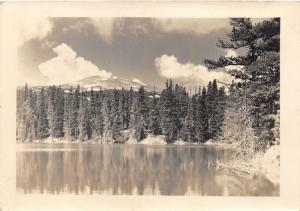 Ward (?) Colorado~Tall Evergreens Along Lake~Mountain in Distance~1944 RPPC