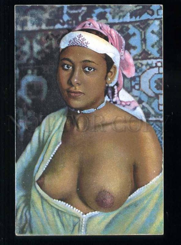 213638 Semi-nude Arabian girl in HAREM carpet Vintage postcard