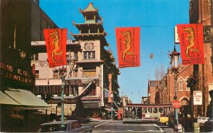 United States California San Francisco Chinatown Grant Avenue flags cable car