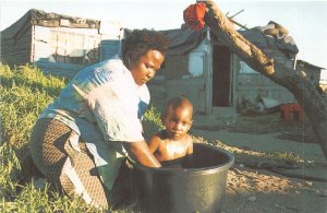 Lot156 woman children cape town south africa evening bath time