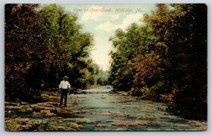 Hollister Missouri~View Of Man Walking Along Coon Creek~Made In Germany~Postcard