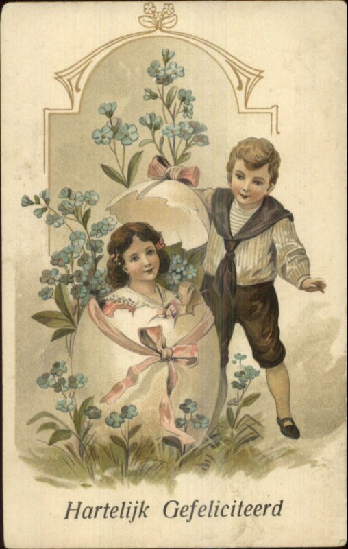 Easter - Boy Find Girl in Giant Egg Shell c1910 Postcard