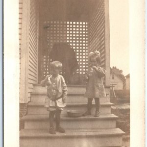 c1910s Cute Boy & Girl Blow Bubbles RPPC Play Outside House Real Photo PC A125