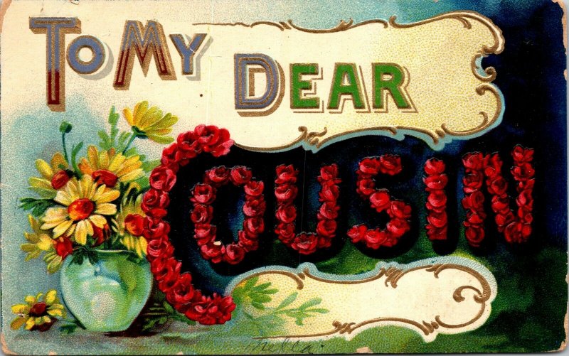 VINTAGE GREETING POSTCARD TO MY DEAR COUSIN EMBOSSED FLOWERS POSTED 1909