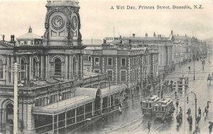 A WET DAY PRINCES STREET DUNEDIN NEW ZEALAND TROLLEY & CLOCK POSTCARD (c. 1907)*