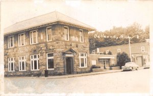 J36/ Bellevue Michigan RPPC Postcard c1940s City Building Automobile 144