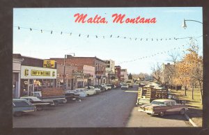 MALTA MONTANA DOWNTOWN STREET SCENE 1950s CARS STORES VINTAGE POSTCARD