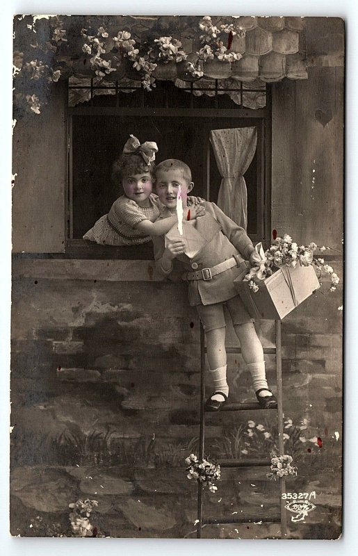 c1910 CUTE CHILDREN STUDIO PROP FLORAL WINDOW LADDER PHOTO RPPC POSTCARD P1339