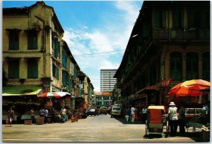 VINTAGE CONTINENTAL SIZE POSTCARD FRUIT STALLS OUTSIDE OLD BUILDINGS SINGAPORE