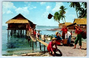 Fisherman preparing for work native huts PHILIPPINES Postcard