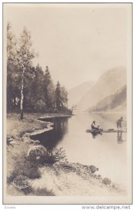 RP: Man fishing off a raft in Fjord , Norway , 00-10s