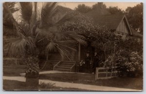 Two Gentlemen Posing in Front of Home Palm Tree Real Photo  RPPC Postcard