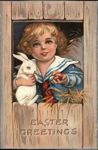 Easter - Little Boy in Barn w/ White Rabbit & Eggs c1910 Postcard