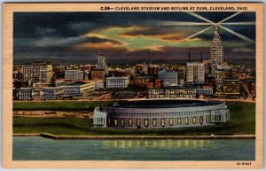 VINTAGE POSTCARD THE CLEVELAND OHIO STADIUM AND SKYLINE AT DUSK MAILED 1948