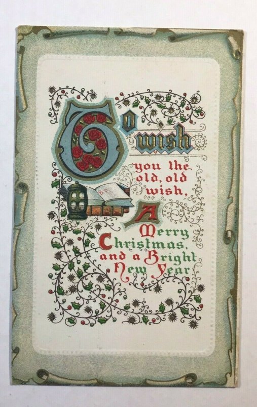 C.1911 Christmas Book Lantern Scroll Ivy Embossed Border Postcard McKinley