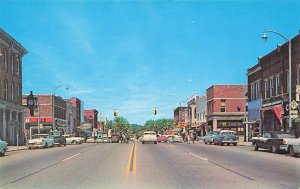 Howell MI Street Scene in 1957 Old Cars Storefronts, Postcard