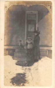 RPPC WOMAN GIRL & HER PET DOG IN WINTER REAL PHOTO POSTCARD (c. 1910)