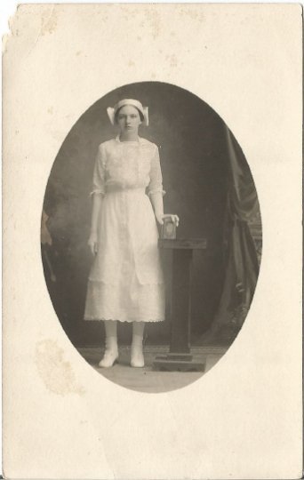 Old Photograph of young Dutch Woman holding an intricate box Vintage Postcard