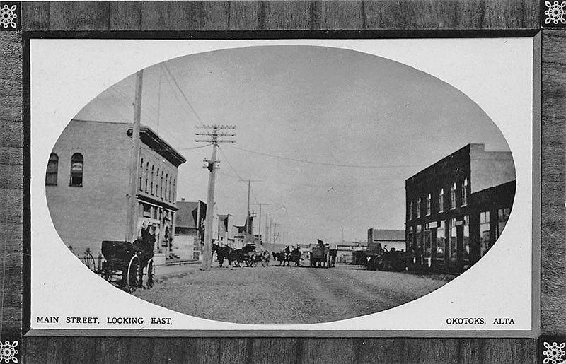 Okotoks Alberta Main Street Horse & Wagons Storefronts in 1911 RPPC Postcard