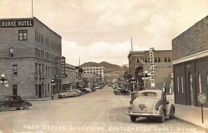 Lewiston MT Main Street Storefronts Gas Station Sign Real Photo Postcard