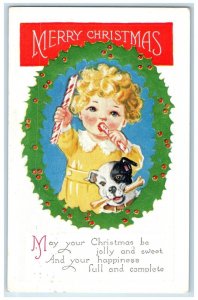 1926 Christmas Whreat Berries Cute Girl Eating Candy Dog Bone Embossed Postcard