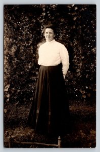 RPPC Lady in Glasses with Hands Behind Back AZO 1904-1918 ANTIQUE Postcard 1455