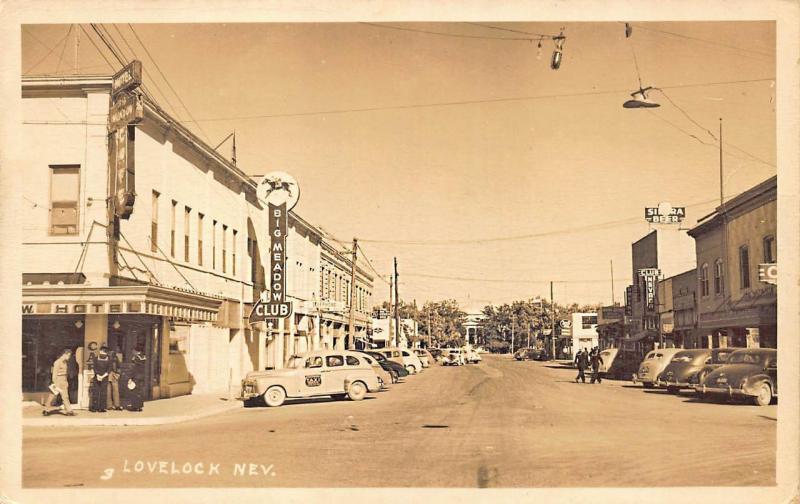 Lovelock NV Main Street Storefronts Big Meadow Club Old Cars Taxi RPPC Postcard