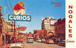 Nogales Mexico Street View Storefronts Old Cars Bus Mickey Mouse Postcard