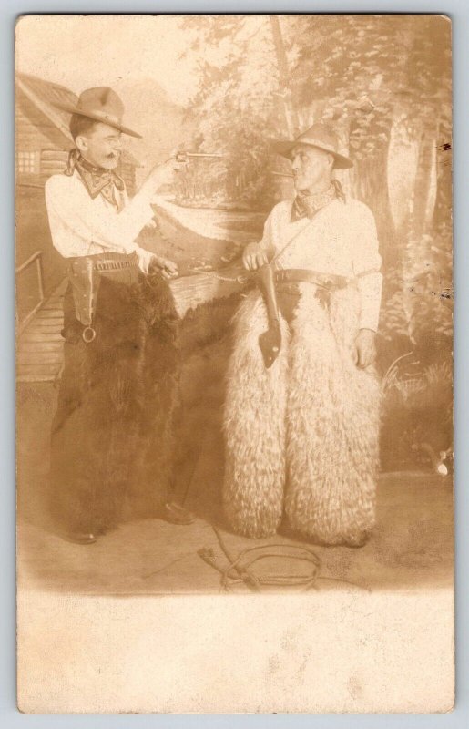 Postcard RPPC Men Dressed as Cowboys w Cigar Guns in Fur Pants - Novelty Photo