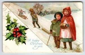 Christmas Postcard Cherub Boy Girl Sleds Muff Ernest Nister Bavaria 1909 Vintage