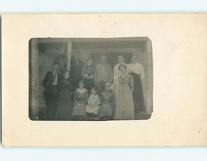 Pre-1920 rppc GROUP SHOT OF FAMILY ON THE PORCH r6479