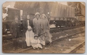 RPPC Family Photo with Train on Tracks Odd Wreck or Double Exposure Postcard L40
