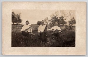 RPPC Men with Instruments Guitar Violin Mandolin Thompson Salem IA Postcard U30