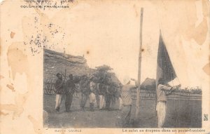 Lot183 upper guinea flag salute at a border post africa types folklore