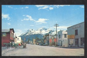 VALDEZ ALASKA DOWNTOWN MAIN STREET SCENE OLD CARS STORES VINTAGE POSTCARD