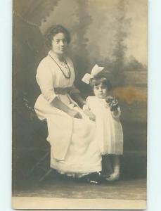 Pre-1920's rppc CUTE GIRL WITH BOW IN HAIR HOLDS OBJECT IN HAND - WITH MOM r6274