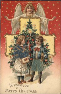 Christmas Angel Above Children Presents Embossed c1900-20s Vintage Postcard